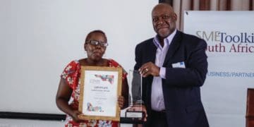 Business Partner CEO David Morobe with winner Zama Ngwenya
