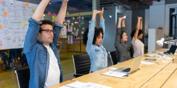 Group of Latin American Workers doing stretching exercises in a business meeting at the office - healthy lifestyle concepts
 (Group of Latin American Workers doing stretching exercises in a business meeting at the office - healthy lifestyle concepts
,