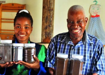 Liza Legodi and her father Lesiba showing off the coffee beans they plant